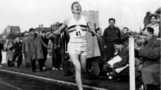 Roger Bannister completing the first sub 4 minute mile.