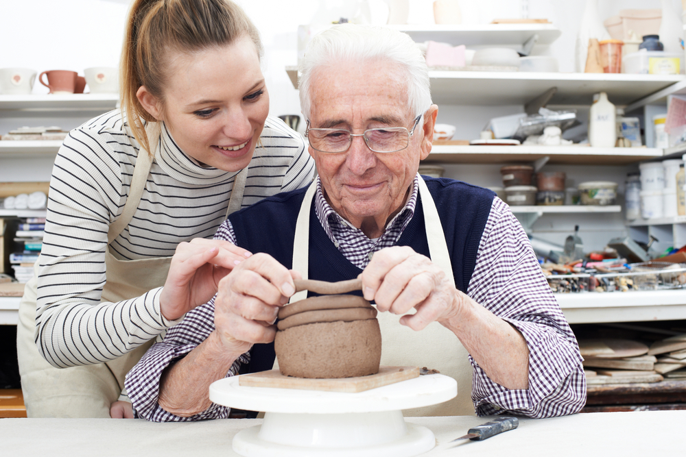 Senior,Man,With,Teacher,In,Pottery,Class