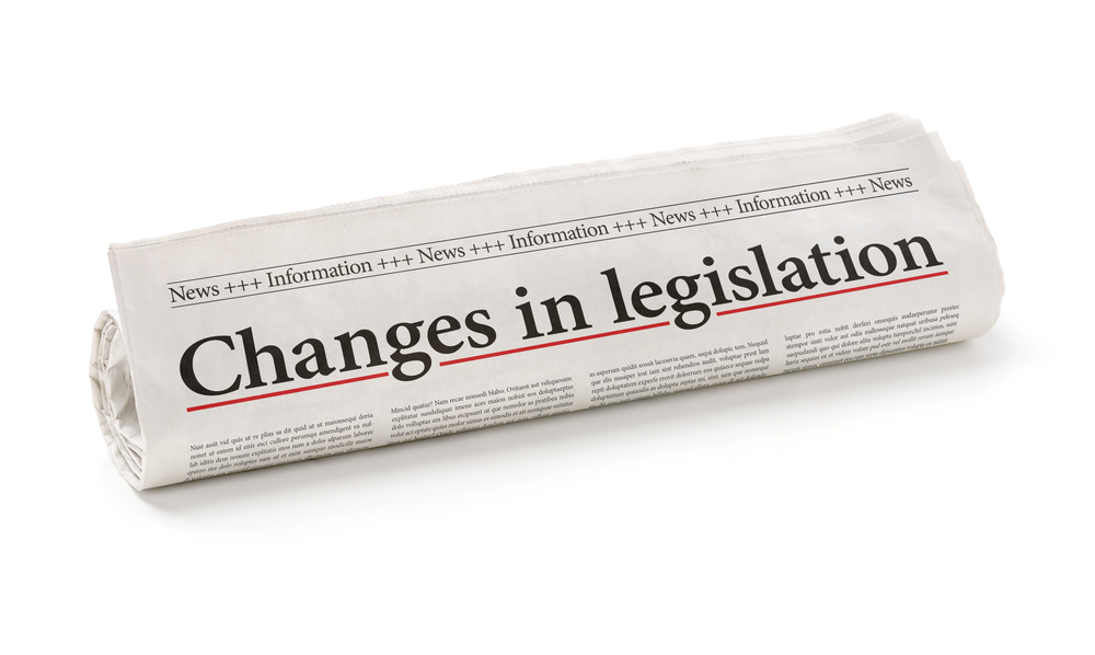 Rolled,Newspaper,With,The,Headline,Changes,In,Legislation