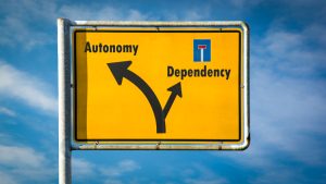 Street,Sign,Autonomy,Versus,Dependency
